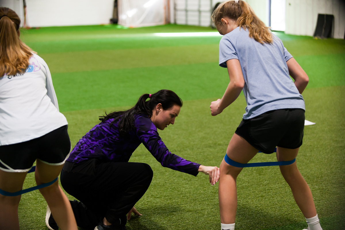 Coach interacting with athlete during training